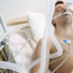 A man on artificial respiration after a coma